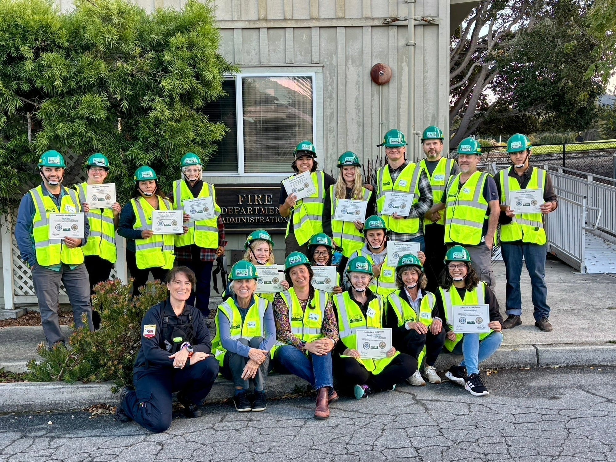 Monterey CERT graduates celebrate in front of the Monterey Fire Department.