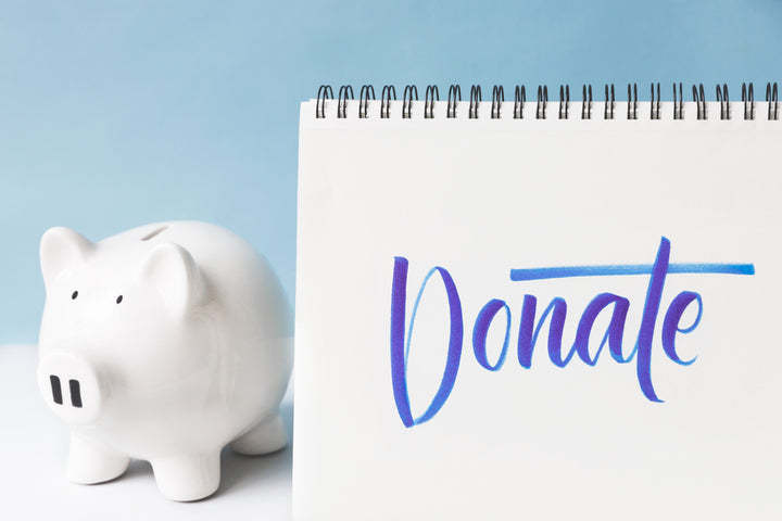 files/donate-written-in-cursive-next-to-a-piggy-bank.jpg
